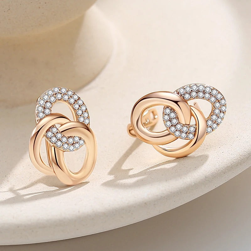 AROS DE ESLABONES CON TACHUELAS BAÑADO EN ORO 18K - BRSI255