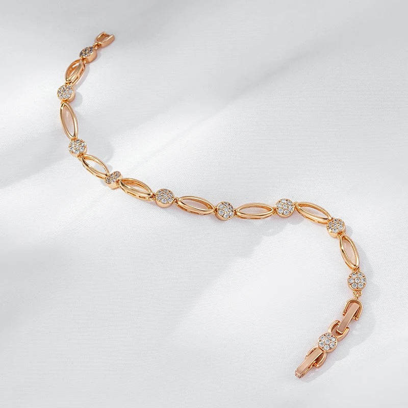 PULSERA CON TACHUELAS BAÑADA EN ORO 18K - PLSI036