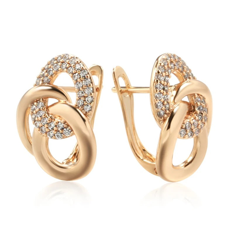 AROS DE ESLABONES CON TACHUELAS BAÑADO EN ORO 18K - BRSI255