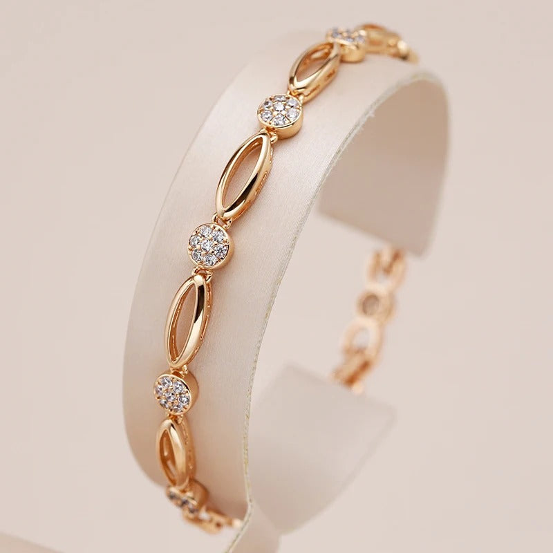 PULSERA CON TACHUELAS BAÑADA EN ORO 18K - PLSI036