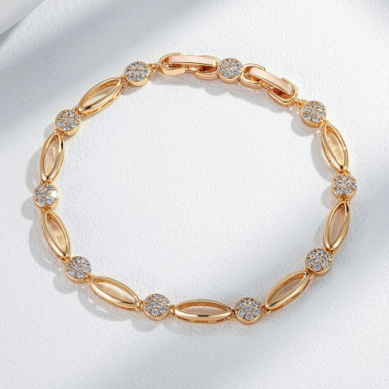 PULSERA CON TACHUELAS BAÑADA EN ORO 18K - PLSI036