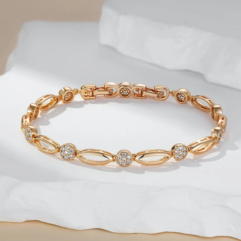 PULSERA CON TACHUELAS BAÑADA EN ORO 18K - PLSI036