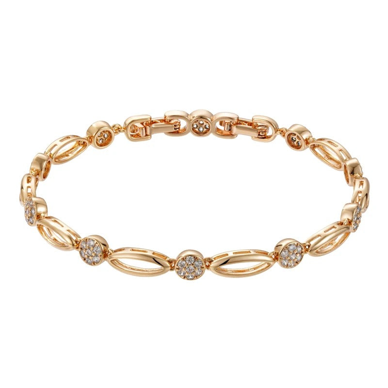 PULSERA CON TACHUELAS BAÑADA EN ORO 18K - PLSI036